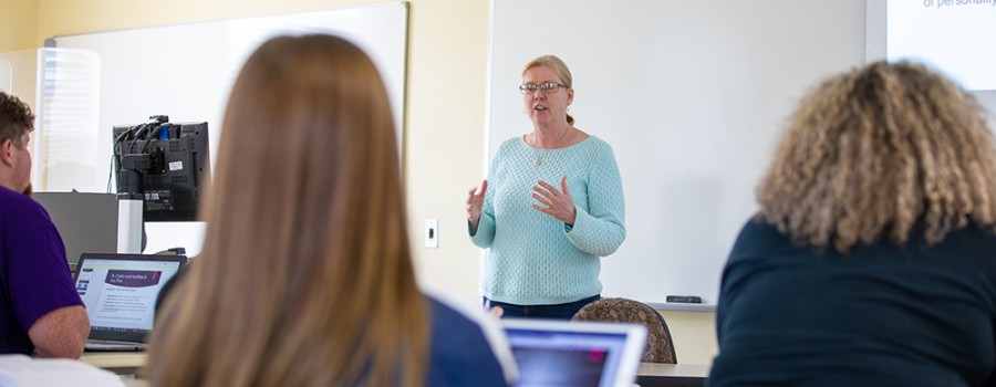 Female professor teaching a class