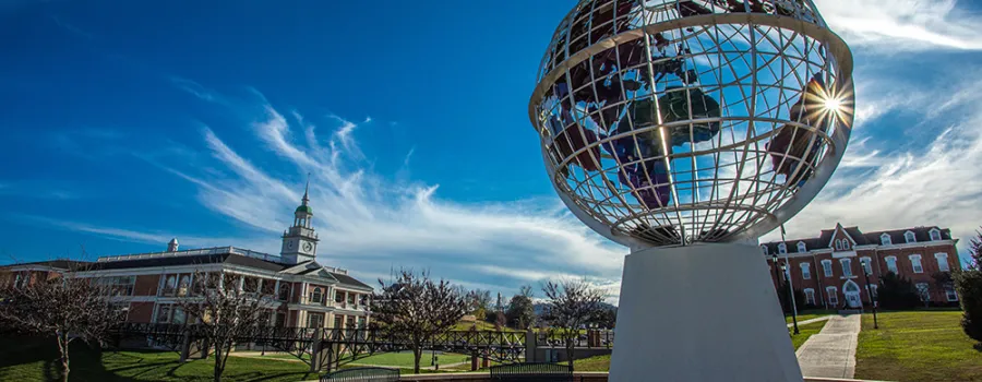 A picture of the campus showing the globe statue 