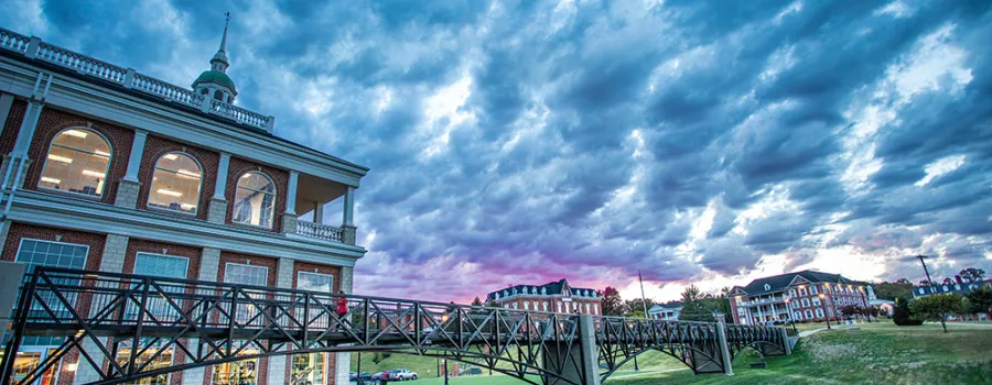 An image of the campus and its buildings at sunset. 