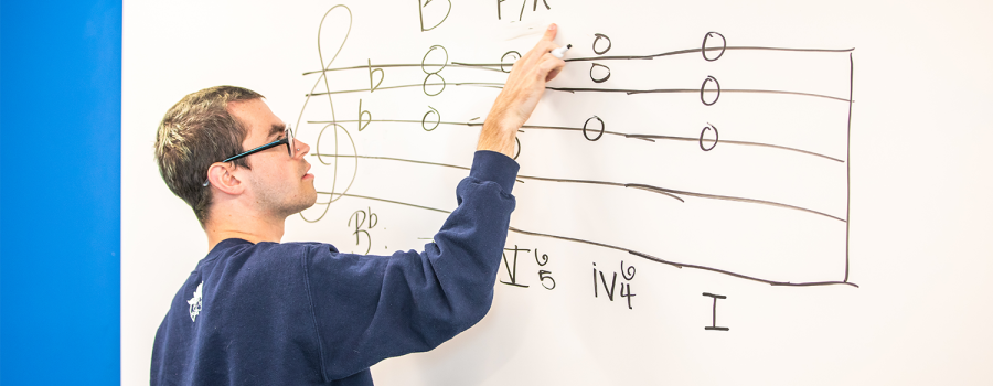 A music student practices music dictation