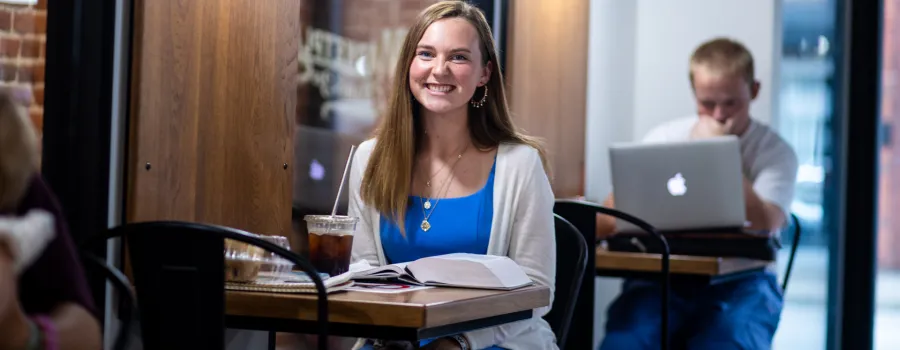 A student studies inside Cumberlands coffee shop. 