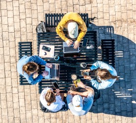 An aerial footage of several students studying outside