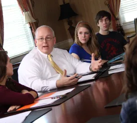 Professor teaching small group