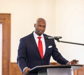 man speaking into a microphone