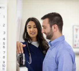PA student checks a patient's weight