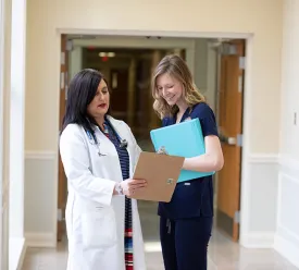 PA professor explaining information to a student