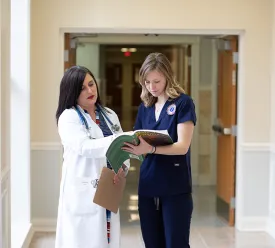 Two medical professionals in conversation.