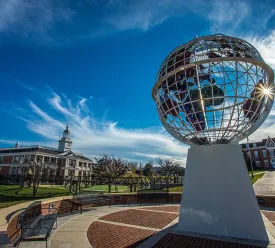 A picture of the campus showing the globe statue 