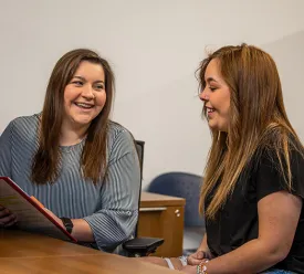 Adult talking with a student