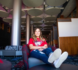 A student relaxes in the library lounge