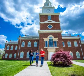 Students walk on campus near HSB