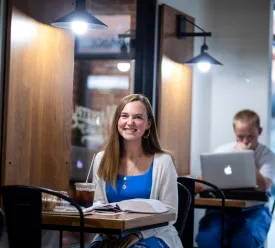 A student studies inside Cumberlands coffee shop. 