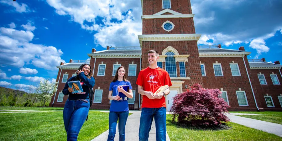 Students walk outside Hutton School of Business