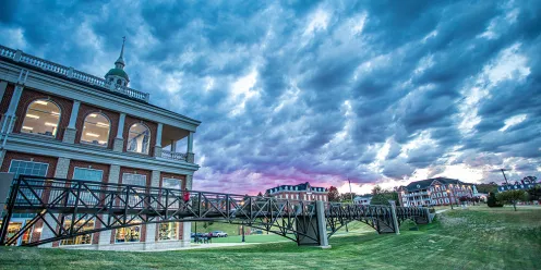 An image of the campus and its buildings at sunset. 