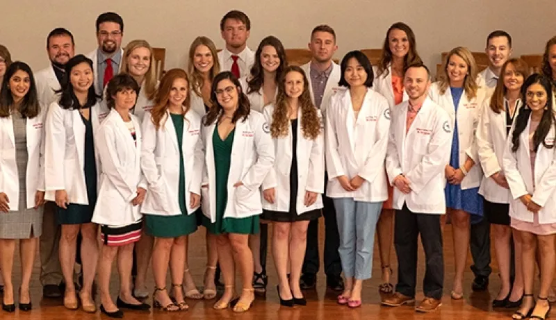 Students wearing physician coats