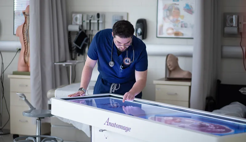 PA student using Anatomage table in PA lab
