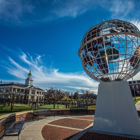 A picture of the campus showing the globe statue 