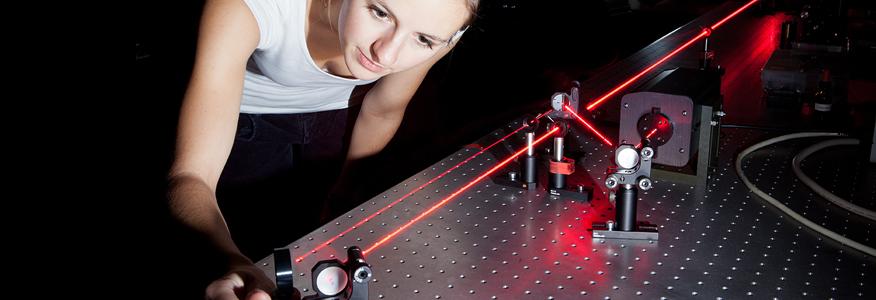 A bachelor's in applied physics degree student with a laser.