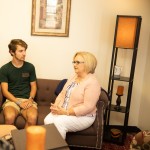 Counselor sitting in a room with two other people