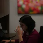 Overworked sitting at a desk