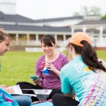 Students seated outside