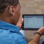 A woman looking at a tablet