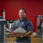A personal trainer in a gym