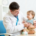 A doctor using a stethoscope on a child