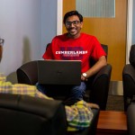 Two students seated across from each other