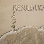 Writing on the beach in the sand