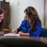 Two students studying together at a table