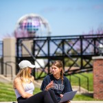 Two students having a conversation outside