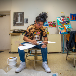 Student working on art project in the art classroom. 