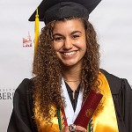 A student wearing a cap and gown