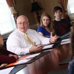 Professor teaching small group