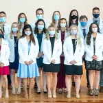 Students wearing physician coats