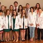 Students wearing physician coats