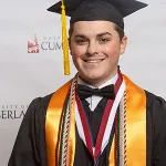 A student wearing a cap and gown