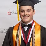 A student wearing a cap and gown