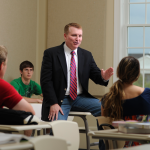teacher speaking to students