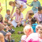 Children sitting in a circle outdoors