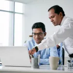 two businessmen working on a problem