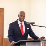 man speaking into a microphone