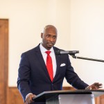 man speaking into a microphone