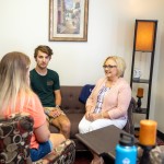 Social worker meeting with two people