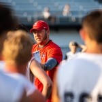 Football coach instructs players