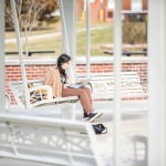Girl using a laptop outdoors
