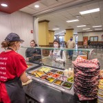 Behind the counter of a small cafe on campus