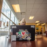 A girl studying on a snow day using a laptop.