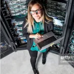FPO graduate student with laptop